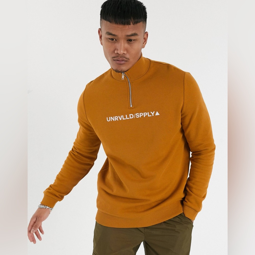 ASOS Urvlld Supply half zip sweatshirt in brown with print.